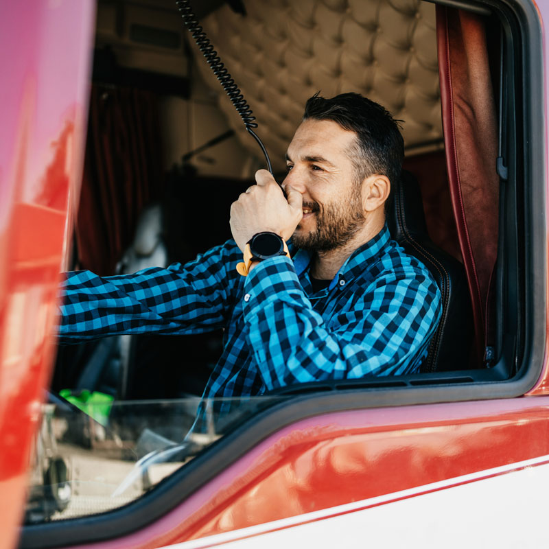 man in cab of truck